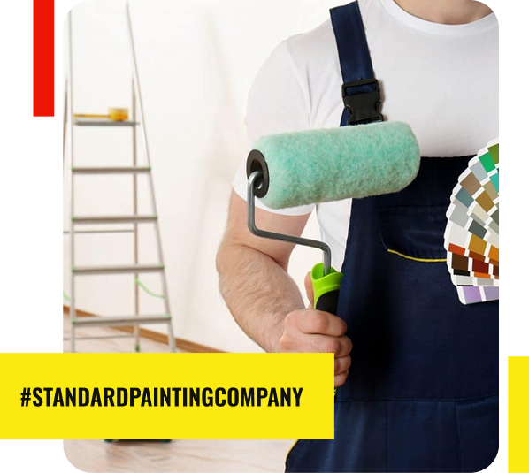 A person in overalls holds a paint roller and a color swatch fan, with a ladder and painting supplies in the background. The text reads #STANDARDPAINTINGCOMPANY, highlighting expert Painting Services in Park Ridge on a yellow banner.